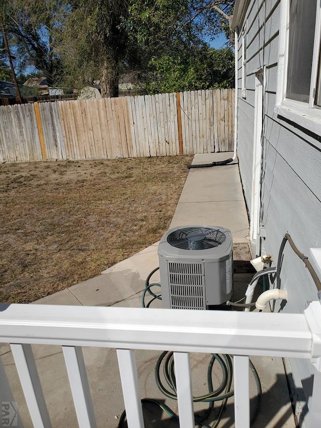 details with central AC unit and fence