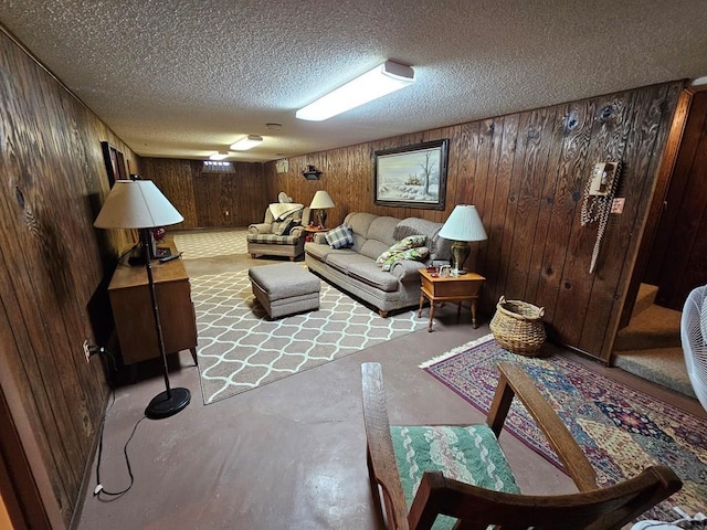 103 S Goff St, Eads, CO 81036 - living room featuring concrete flooring, wood walls, and a textured ceiling