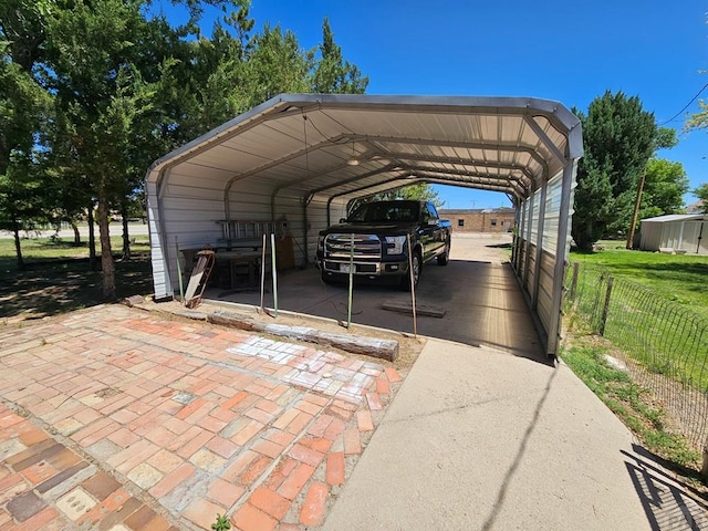 103 S Goff St, Eads, CO 81036 - view of vehicle parking featuring a carport and fence