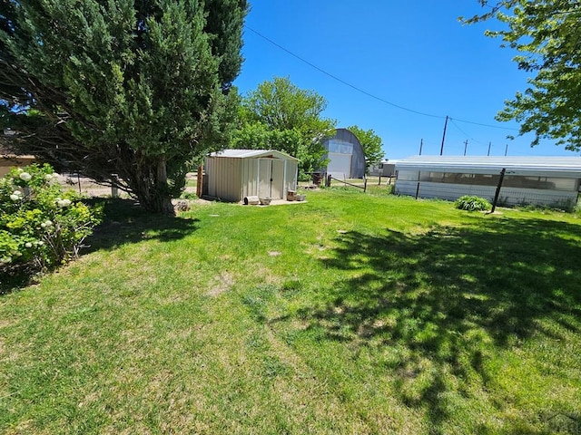 103 S Goff St, Eads, CO 81036 - view of yard featuring a storage shed and an outdoor structure