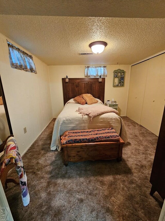103 S Goff St, Eads, CO 81036 - bedroom featuring carpet and a textured ceiling