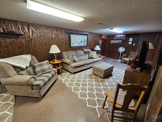 103 S Goff St, Eads, CO 81036 - living room featuring a textured ceiling and wood walls