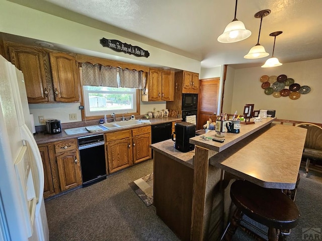 103 S Goff St, Eads, CO 81036 - kitchen with a sink, black appliances, a center island, and brown cabinetry