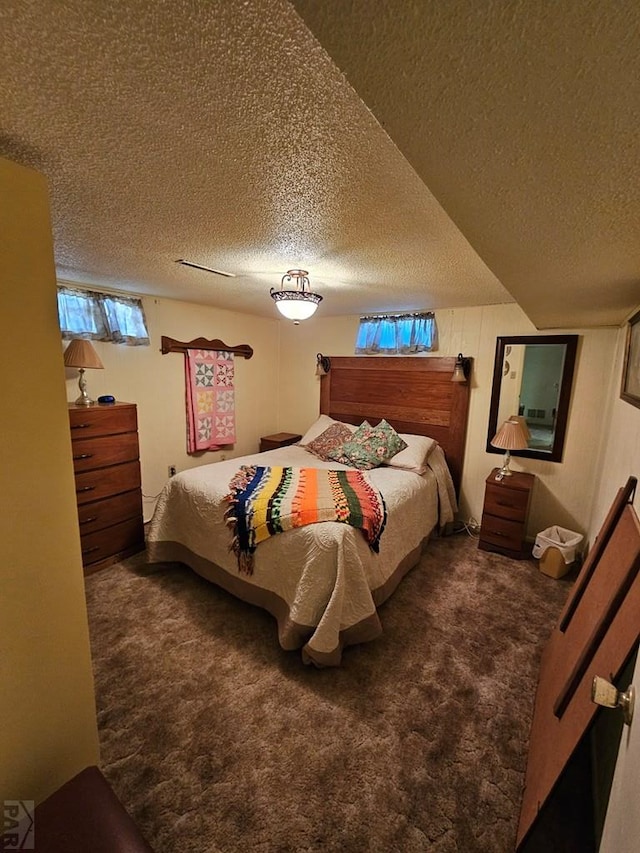 103 S Goff St, Eads, CO 81036 - bedroom featuring carpet flooring and a textured ceiling