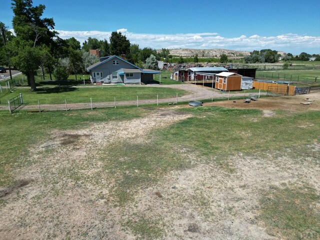 view of stable with a rural view