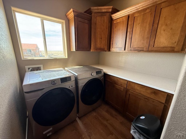 1710 N Wild Bill Hickock Dr, Pueblo West, CO 81007 - laundry room with cabinet space, a textured wall, washing machine and dryer, and dark wood finished floors