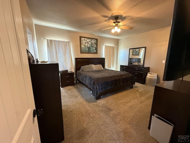 1710 N Wild Bill Hickock Dr, Pueblo West, CO 81007 - bedroom with ceiling fan and light carpet