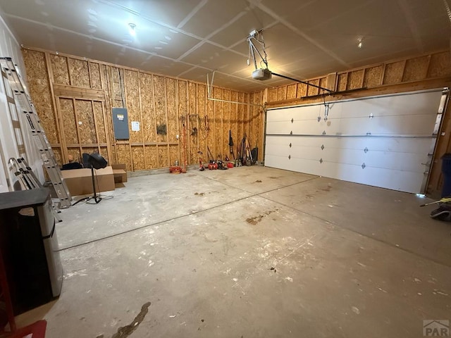 1710 N Wild Bill Hickock Dr, Pueblo West, CO 81007 - garage featuring a garage door opener and electric panel