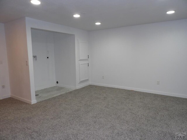 carpeted spare room with recessed lighting and baseboards