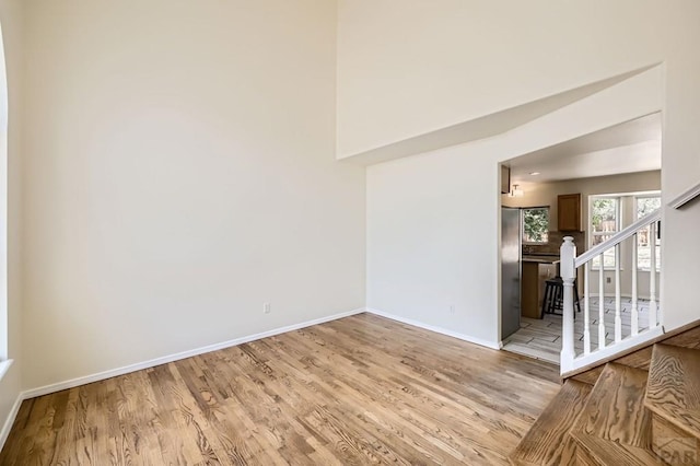 4366 Witches Hollow Ln, Colorado Springs, CO 80911 - unfurnished room featuring light wood-style floors and stairway