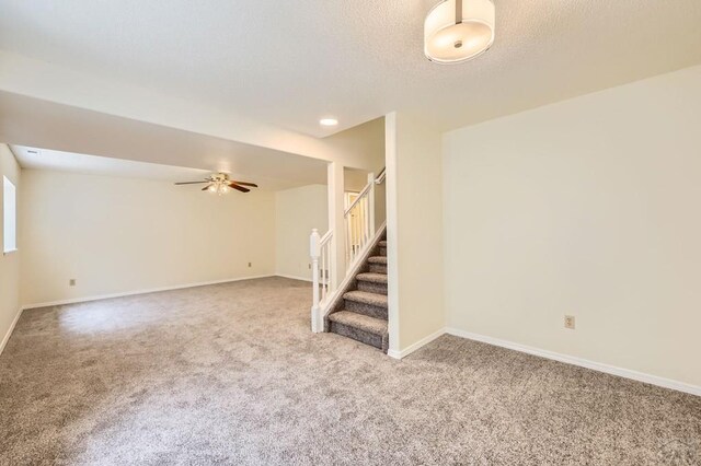 4366 Witches Hollow Ln, Colorado Springs, CO 80911 - carpeted empty room featuring stairs and a ceiling fan