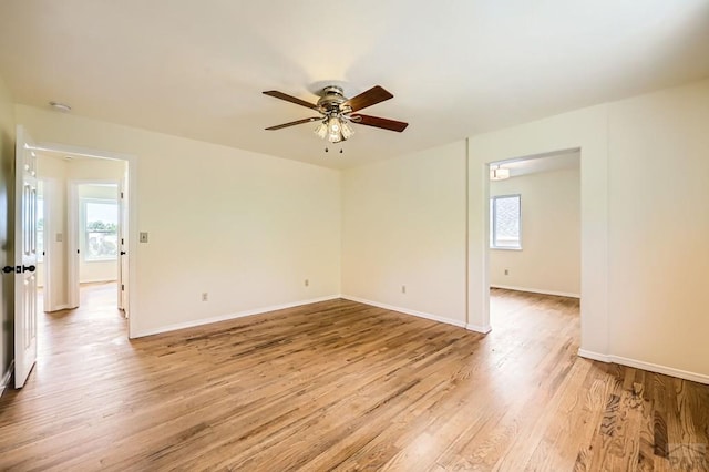 4366 Witches Hollow Ln, Colorado Springs, CO 80911 - empty room featuring healthy amount of natural light, light wood-style floors, and a ceiling fan