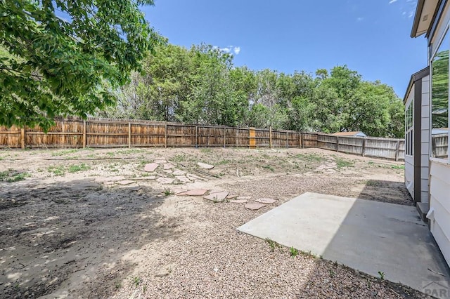 4366 Witches Hollow Ln, Colorado Springs, CO 80911 - fenced backyard featuring a patio area