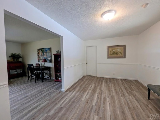 29 Mountview Dr, La Junta, CO 81050 - spare room featuring wood finished floors, a textured ceiling, baseboards, and a smoke detector