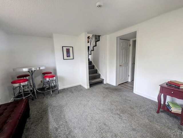 29 Mountview Dr, La Junta, CO 81050 - playroom featuring carpet flooring, baseboards, and a textured ceiling