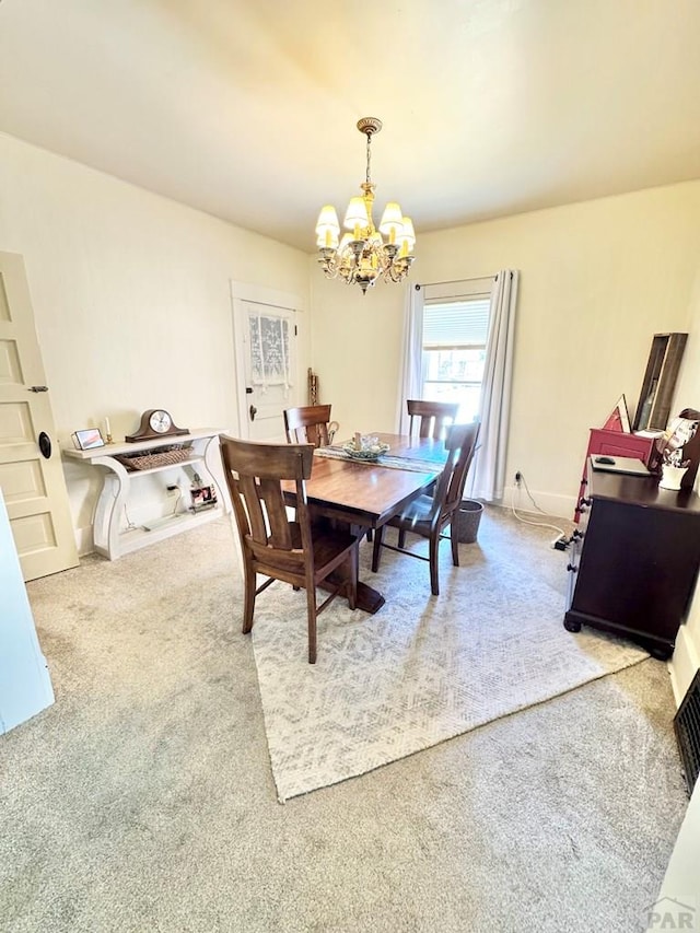 914 Santa Fe, La Junta, CO 81050 - carpeted dining space with a chandelier and baseboards