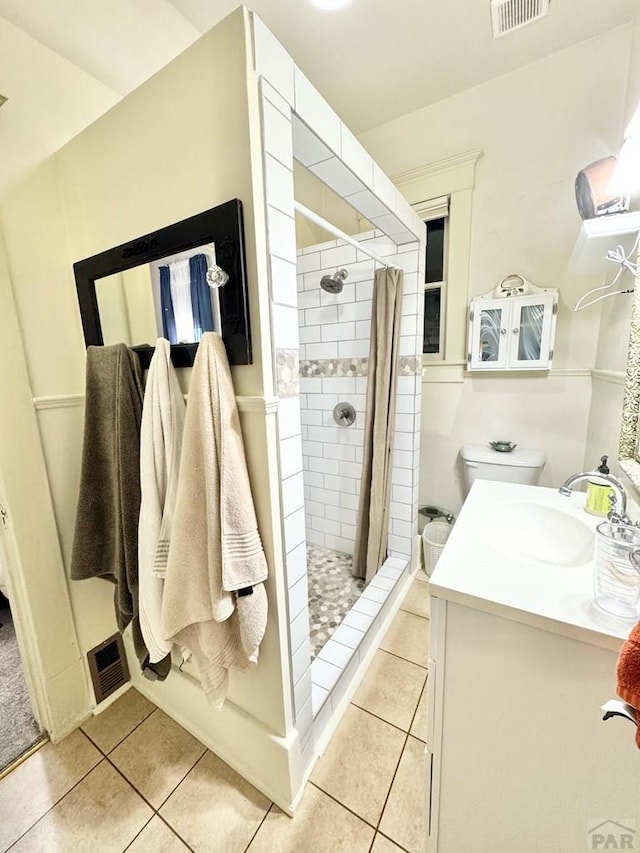 914 Santa Fe, La Junta, CO 81050 - full bathroom with tile patterned floors, a stall shower, and vanity