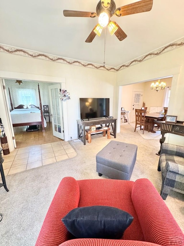 914 Santa Fe, La Junta, CO 81050 - carpeted living area featuring a chandelier, tile patterned floors, and ceiling fan