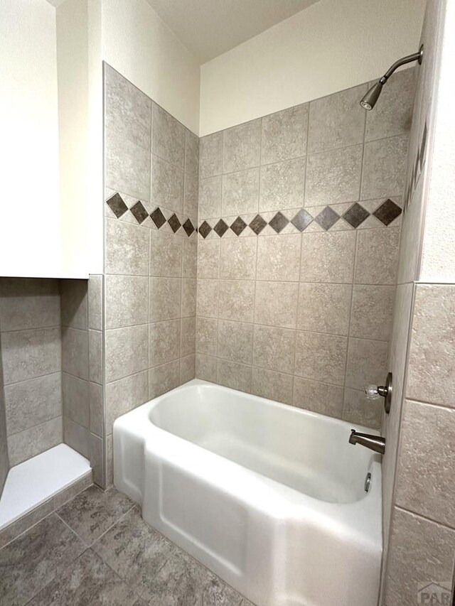 full bathroom featuring bathtub / shower combination and tile patterned floors