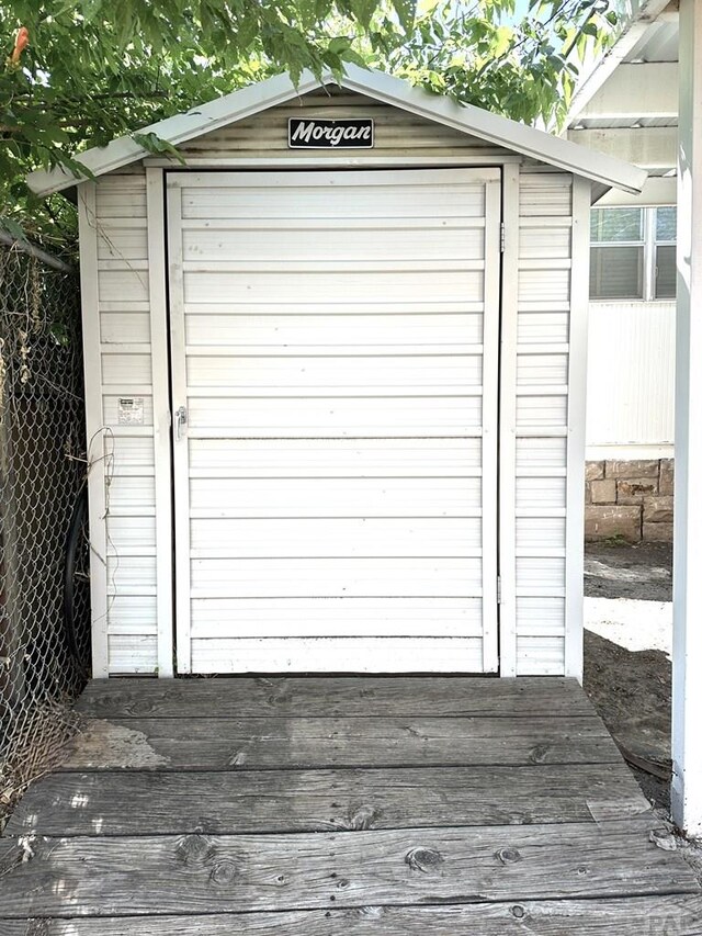 garage featuring a storage shed