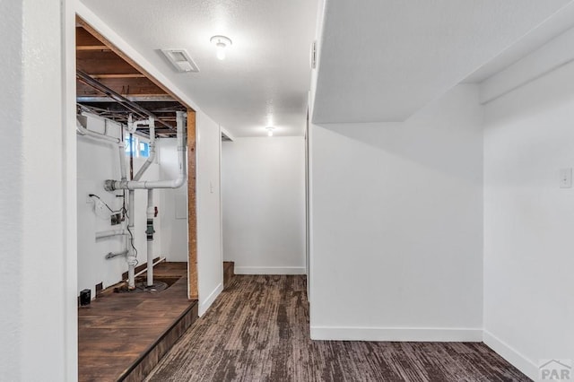 1727 Stone Ave, Pueblo, CO 81004 - basement featuring visible vents, baseboards, and wood finished floors