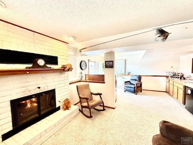 living room with light carpet, a brick fireplace, baseboards, and a textured ceiling