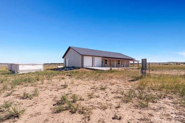 332 Yellow Bird Rd, Rye, CO 81069 - back of property with a detached garage and a metal roof