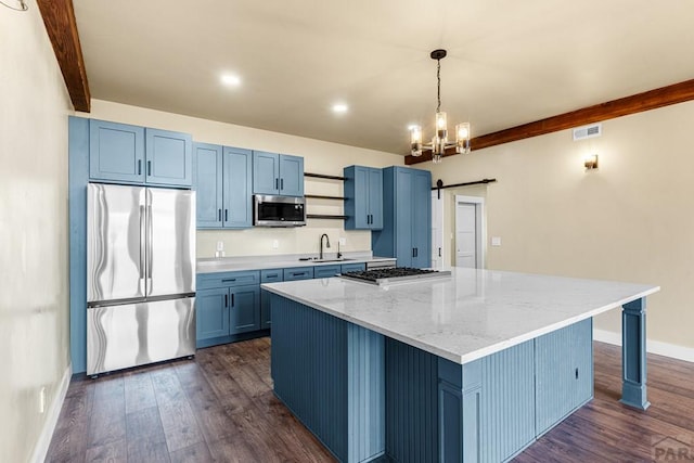 332 Yellow Bird Rd, Rye, CO 81069 - kitchen featuring stainless steel appliances, blue cabinetry, a center island, dark wood-type flooring, and beamed ceiling
