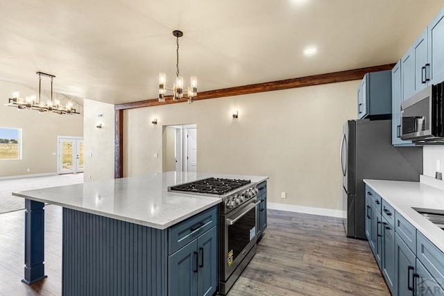 332 Yellow Bird Rd, Rye, CO 81069 - kitchen with stainless steel appliances, a chandelier, a kitchen island, and pendant lighting