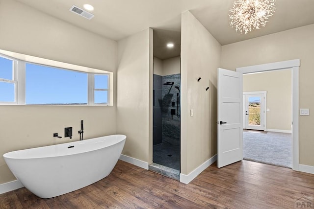 332 Yellow Bird Rd, Rye, CO 81069 - full bathroom with a freestanding tub, tiled shower, and wood finished floors