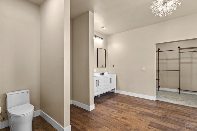 332 Yellow Bird Rd, Rye, CO 81069 - bathroom featuring vanity, wood finished floors, and a chandelier