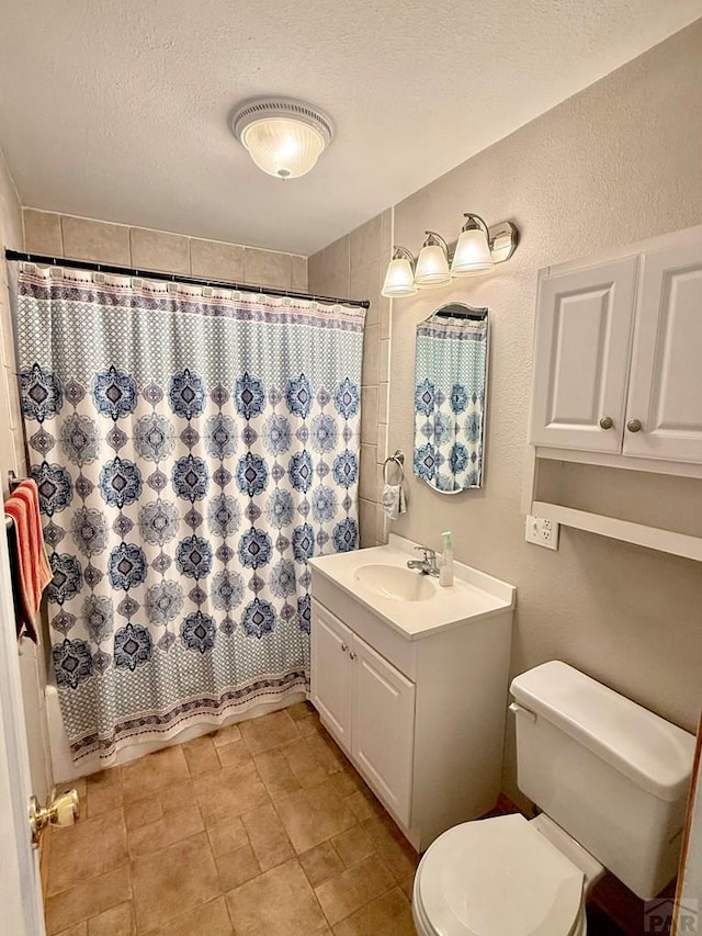 629 Gaylord Ave, Pueblo, CO 81004 - full bathroom with vanity, tile patterned floors, and a textured ceiling