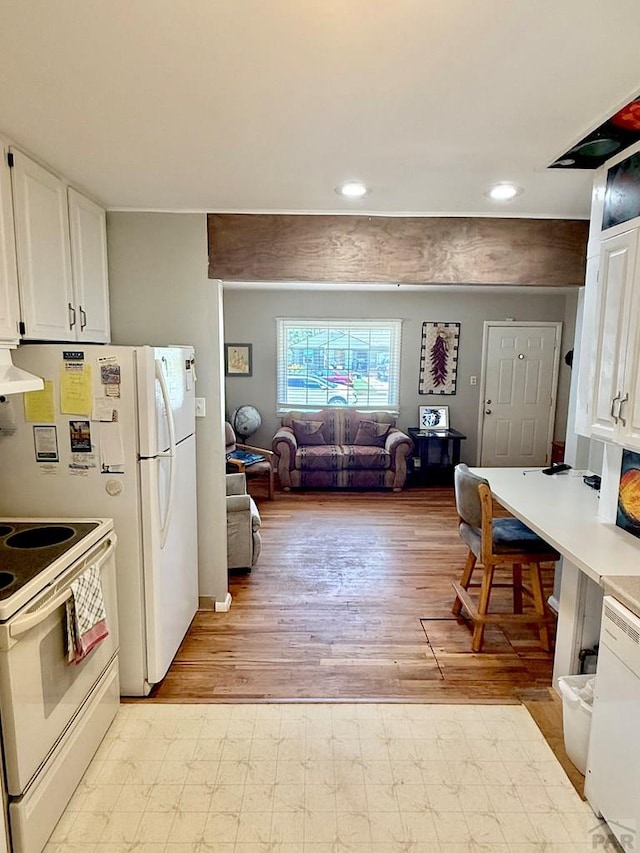 629 Gaylord Ave, Pueblo, CO 81004 - kitchen featuring white appliances, exhaust hood, white cabinetry, light countertops, and recessed lighting