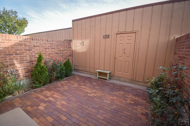 view of outbuilding with fence