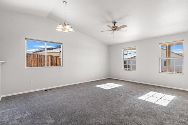 1329 Silver Hawk Ct, Pueblo, CO 81008 - carpeted spare room with baseboards, lofted ceiling, ceiling fan with notable chandelier, and visible vents