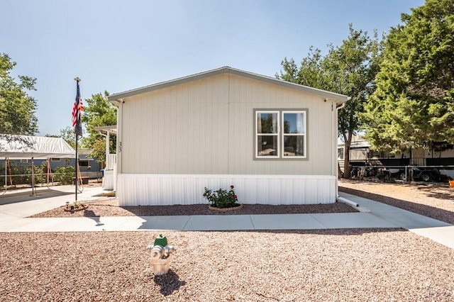 999 Fortino Blvd Unit 33, Pueblo, CO 81008 - view of side of property with fence and a carport