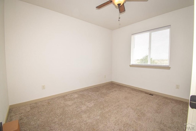 1781 N Billy The Kid Ln, Pueblo, CO 81007 - empty room featuring carpet floors, ceiling fan, visible vents, and baseboards