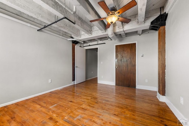 201 Lamkin St Unit 207, Pueblo, CO 81003 - spare room with a ceiling fan, wood finished floors, and beam ceiling
