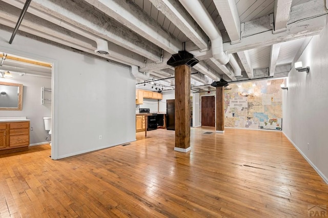 201 Lamkin St Unit 207, Pueblo, CO 81003 - finished basement featuring light wood-style floors and a barn door