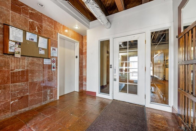 201 Lamkin St Unit 207, Pueblo, CO 81003 - hall featuring elevator and tile walls