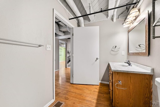 201 Lamkin St Unit 207, Pueblo, CO 81003 - bathroom with vanity and hardwood / wood-style flooring