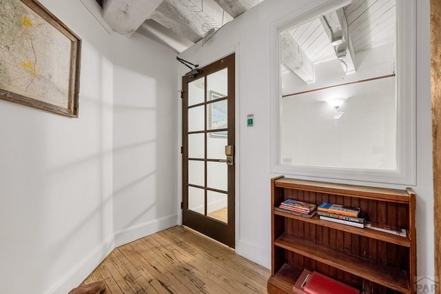 201 Lamkin St Unit 207, Pueblo, CO 81003 - doorway to outside featuring wood-type flooring and baseboards