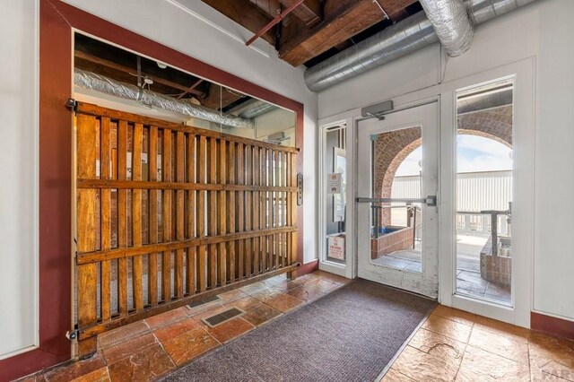 201 Lamkin St Unit 207, Pueblo, CO 81003 - entryway with stone tile flooring and french doors