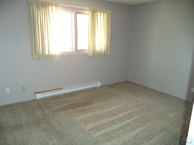 unfurnished room with baseboard heating and carpet floors