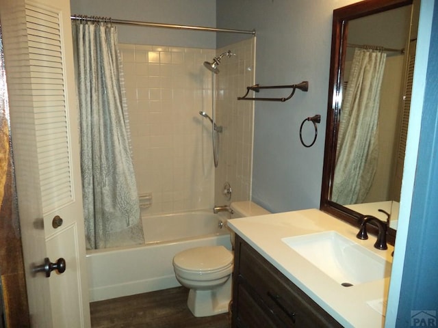 full bathroom featuring toilet, shower / bathtub combination with curtain, vanity, and wood finished floors