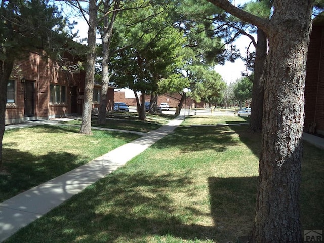 surrounding community featuring a lawn