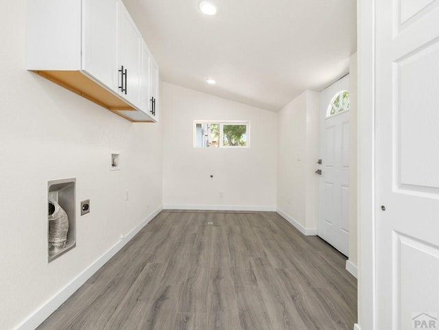 906 E 6th St, Pueblo, CO 81001 - laundry room with cabinet space, hookup for an electric dryer, light wood-type flooring, recessed lighting, and washer hookup