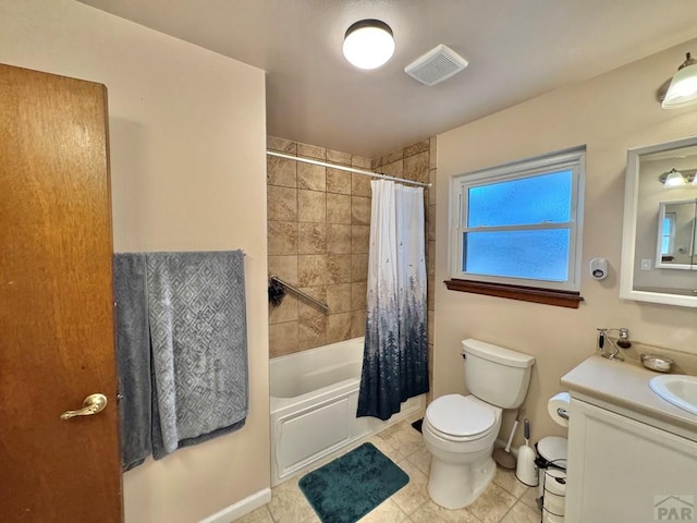 full bath with tile patterned flooring, toilet, vanity, visible vents, and shower / bath combo