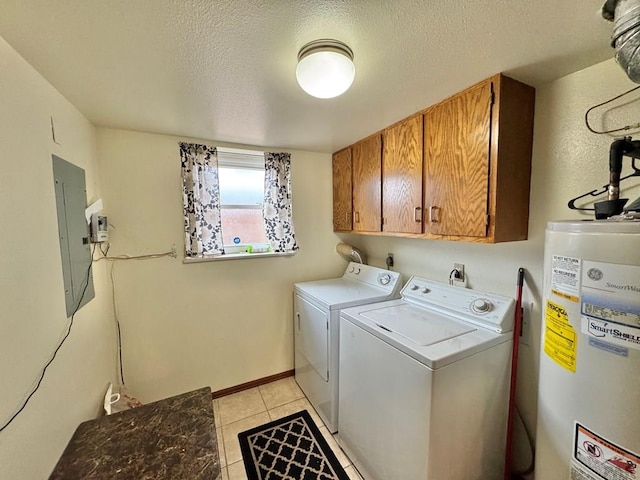 washroom featuring gas water heater, cabinet space, a textured ceiling, electric panel, and independent washer and dryer