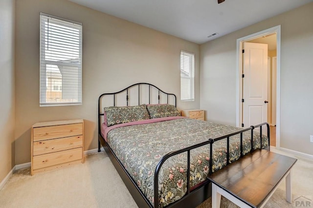 bedroom featuring carpet floors, baseboards, and visible vents